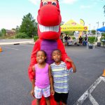 Mascot with children smiling