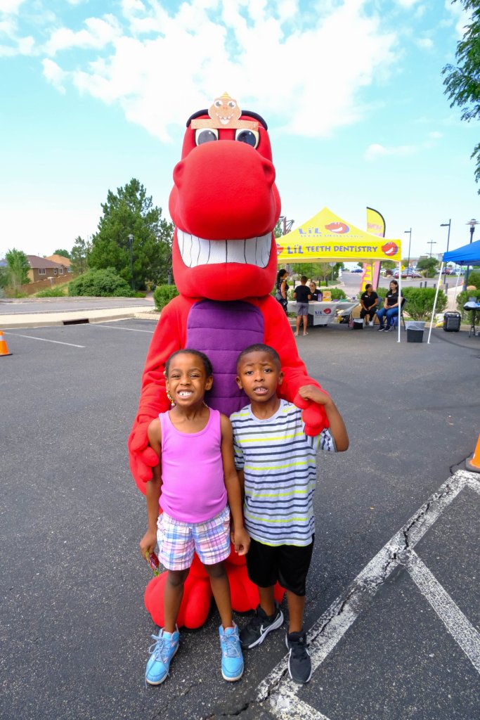 Mascot with children smiling