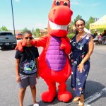 Mascot with children smiling