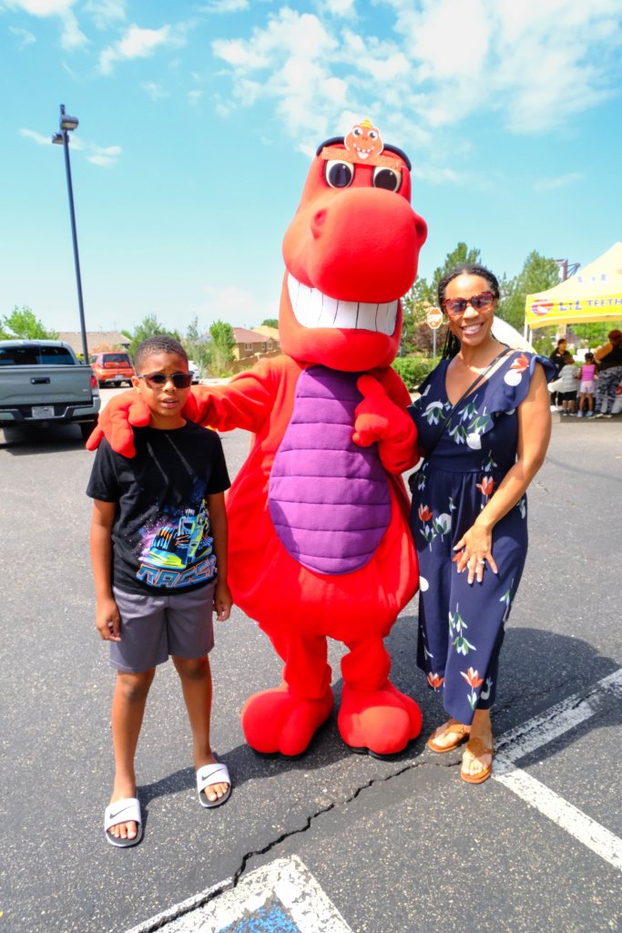 Mascot with children smiling