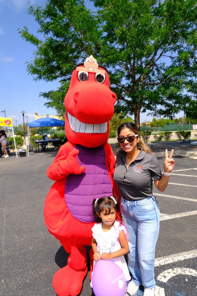 Mascot with children smiling